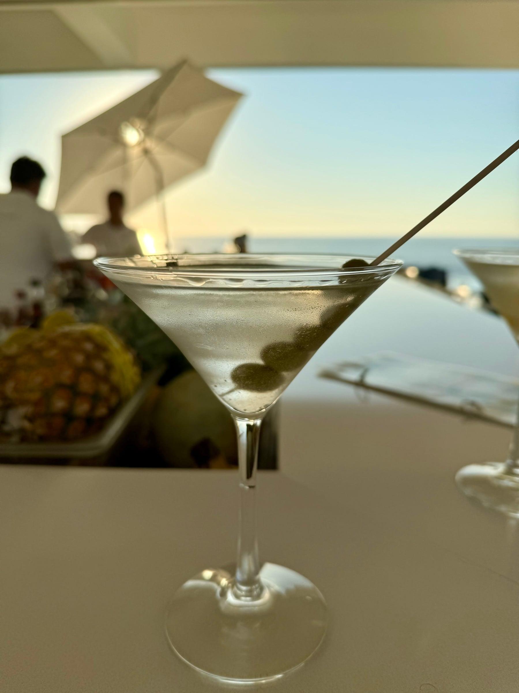 A martini on the rooftop bar at sunset over the Bay of Banderas